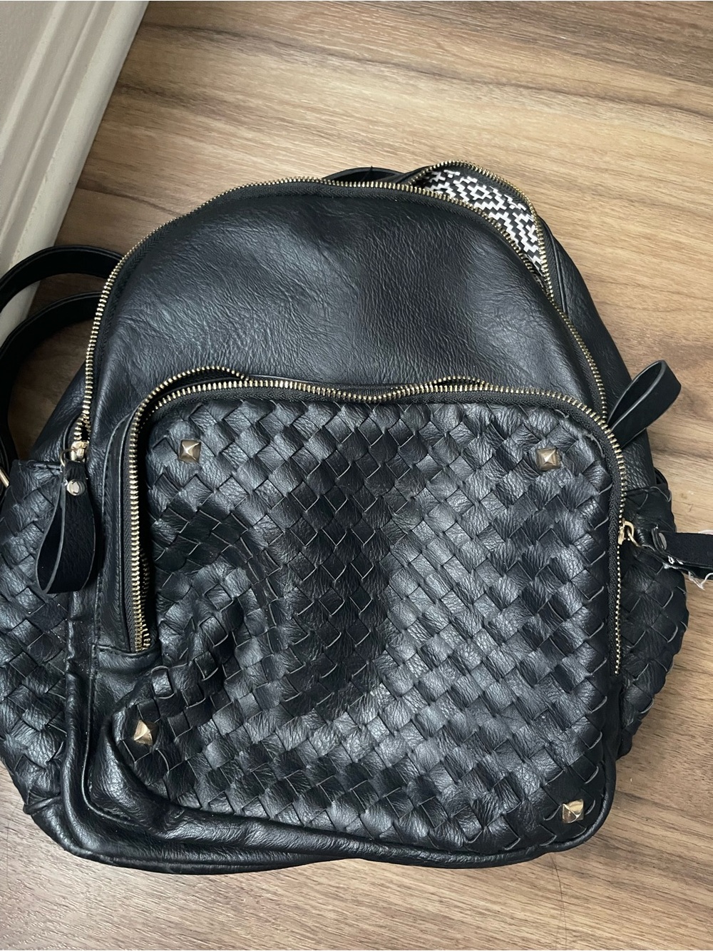 Woven Black Leather Backpack with Gold Accents